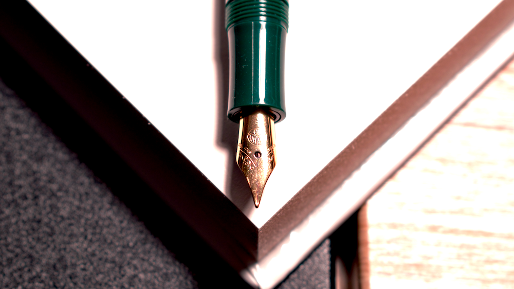 a close up of a pen on a table