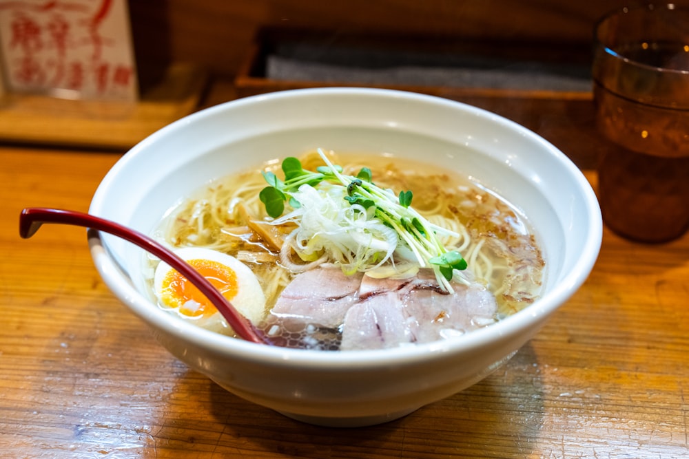 a bowl of ramen with an egg on top