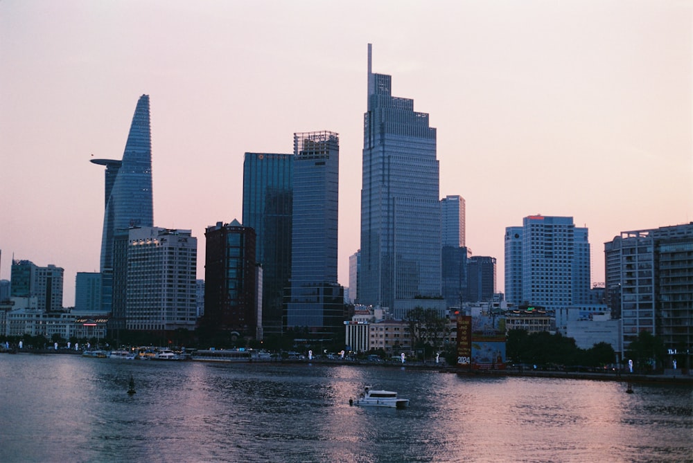 a body of water with a city in the background