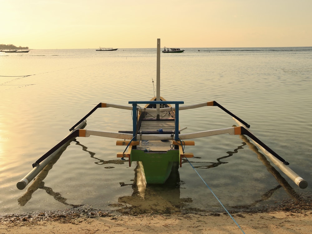 a boat sitting on top of a body of water