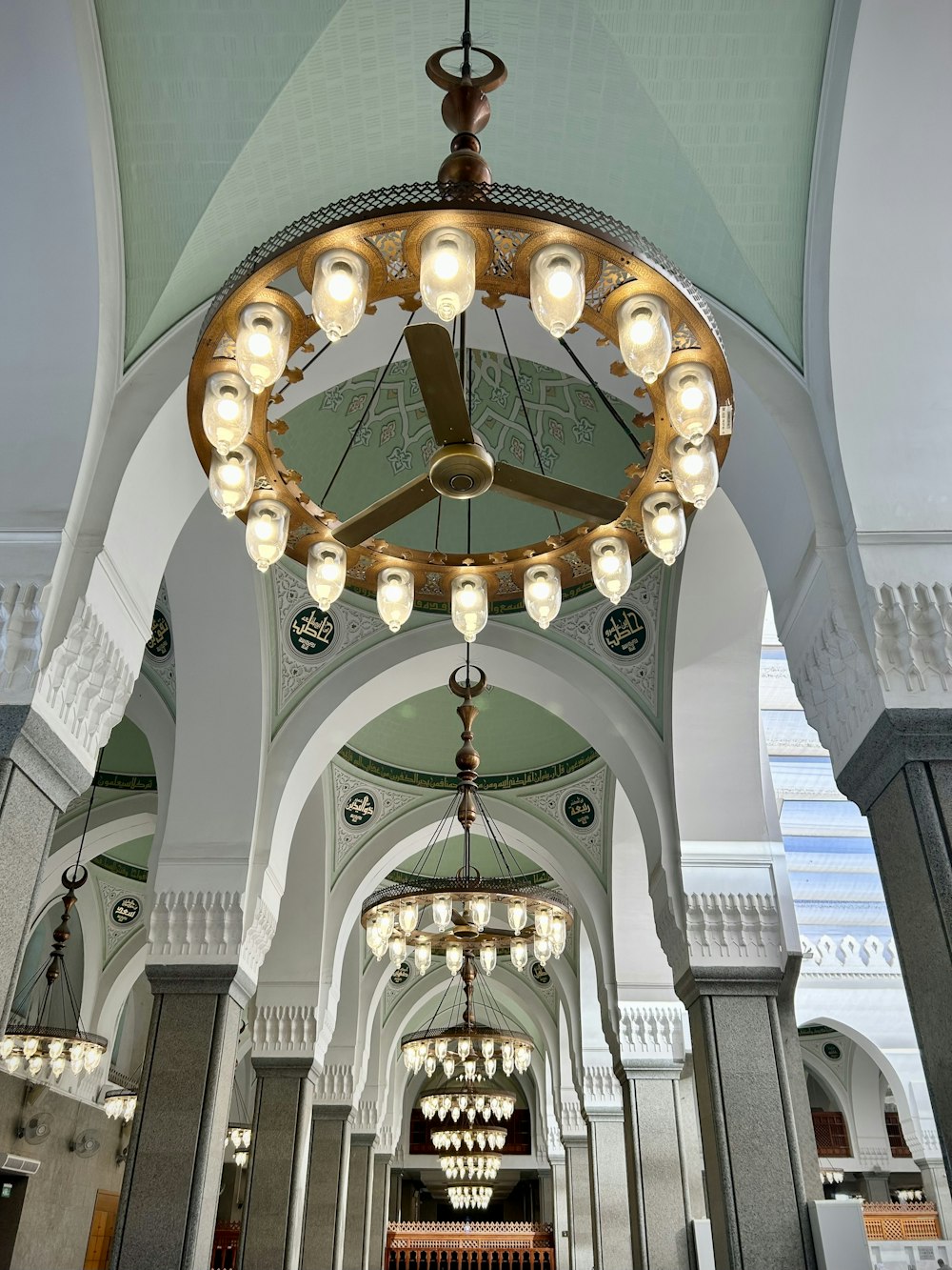 a chandelier hanging from the ceiling of a building