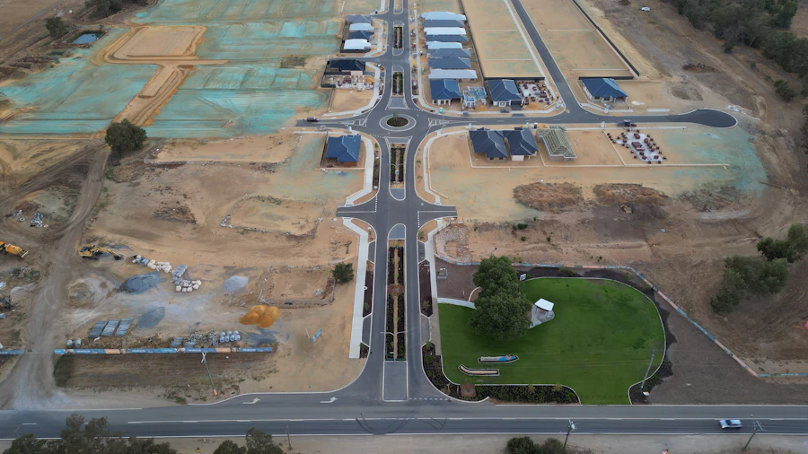 Aerial view of a new development site with streets graded and no homes built yet