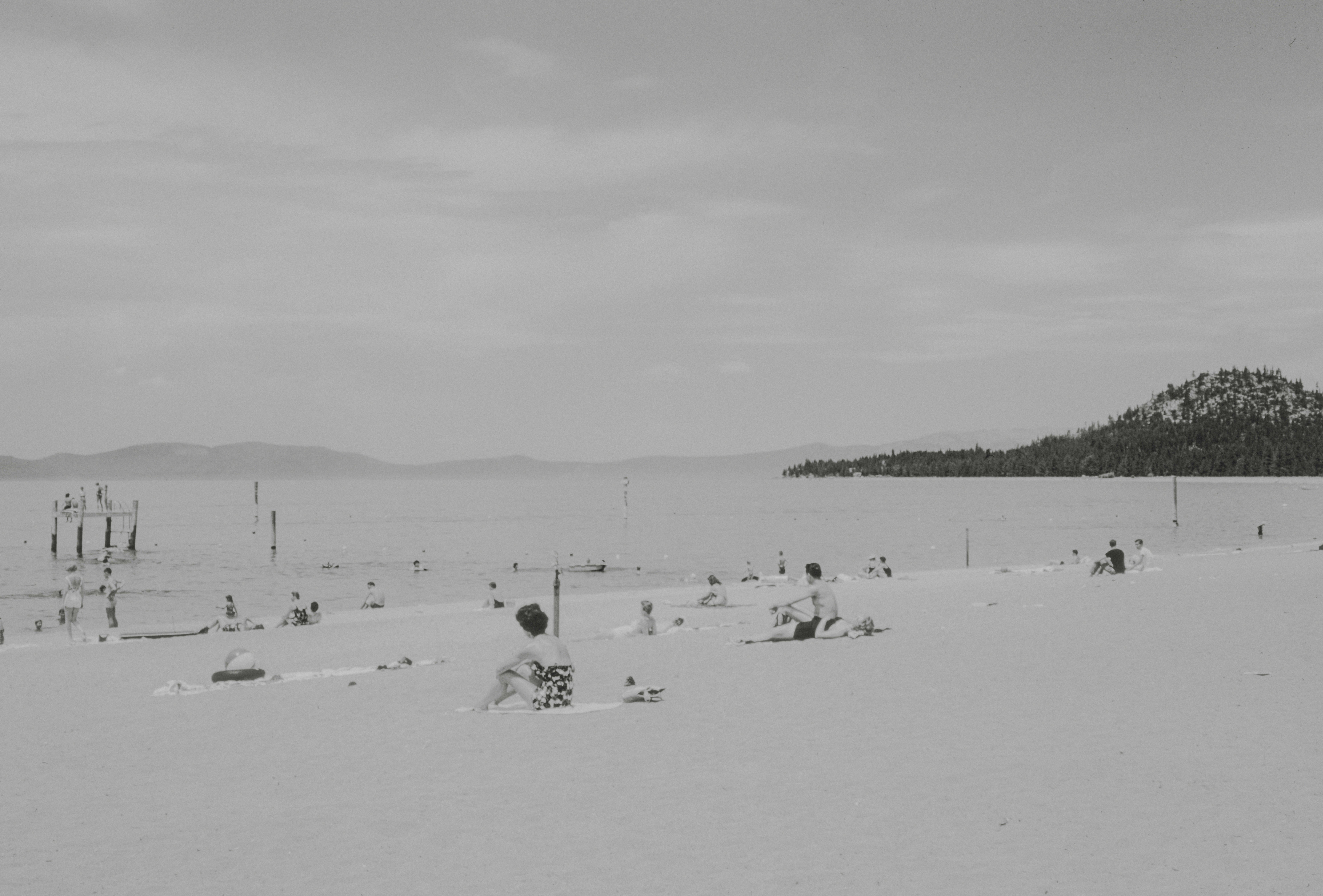 a black and white photo of people on a beach, Beach at Bijou, Lake Tahoe, California 1961