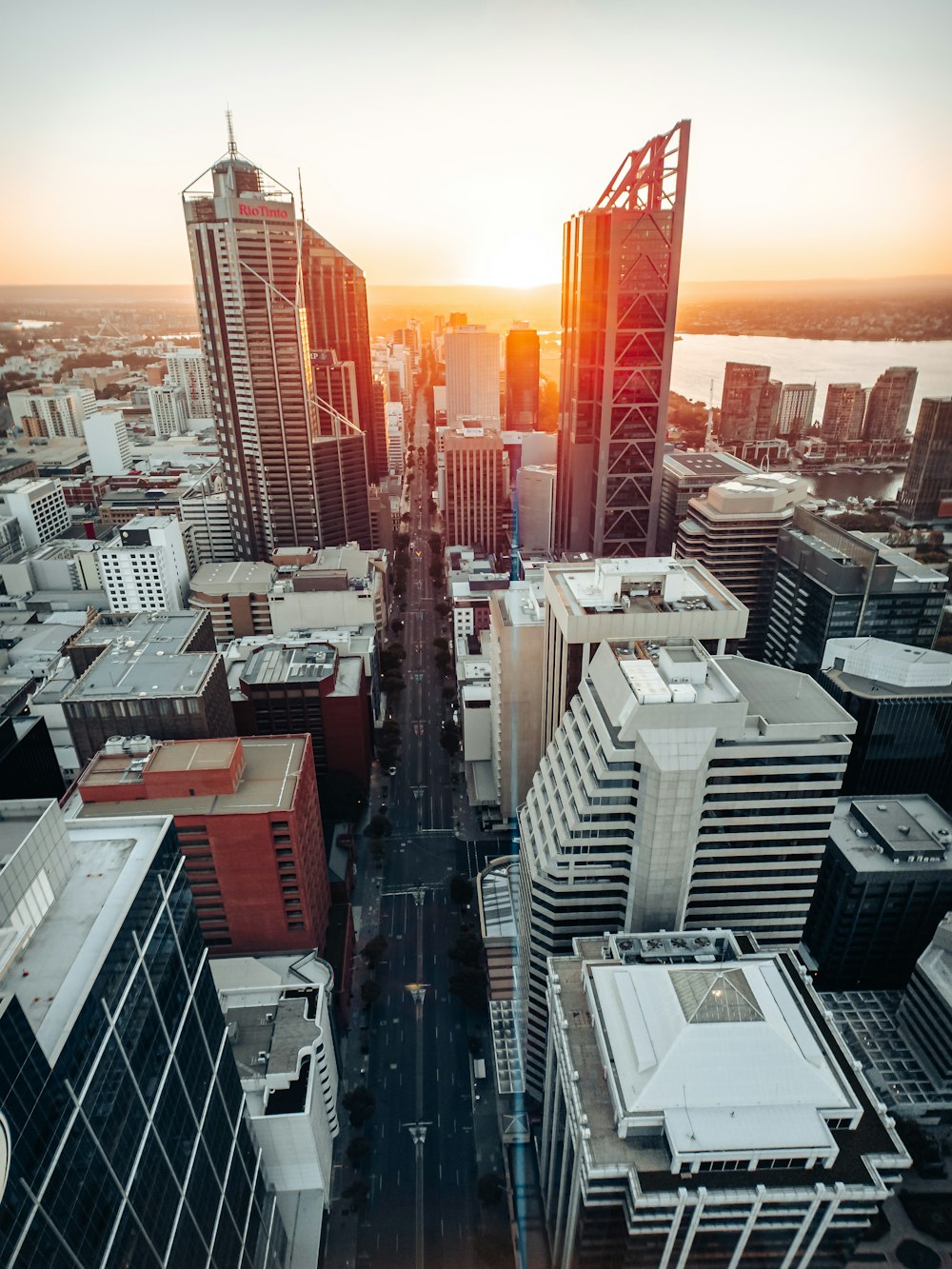 an aerial view of a city at sunset