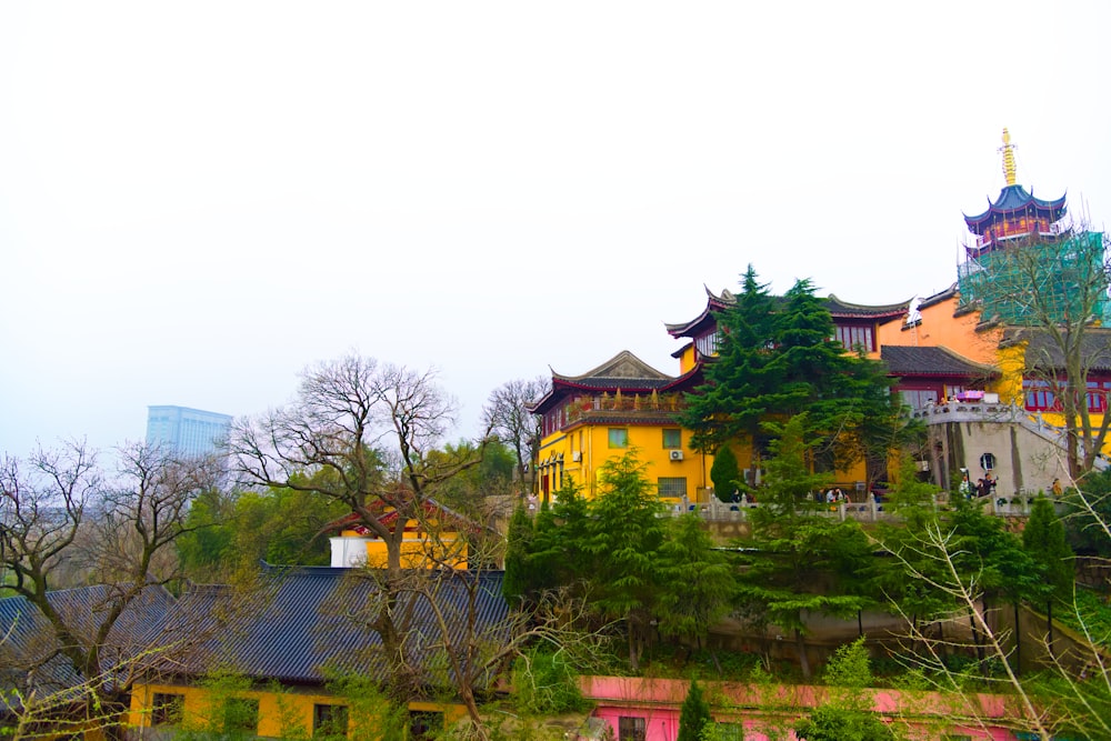 a building with a tower on top of a hill