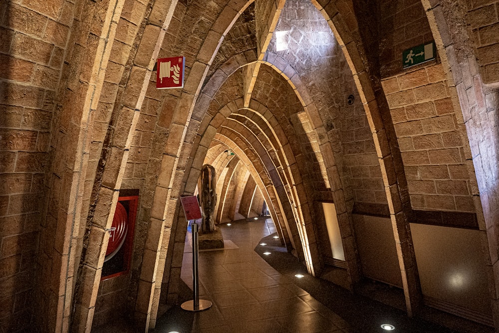 a very long hallway with a clock on the wall