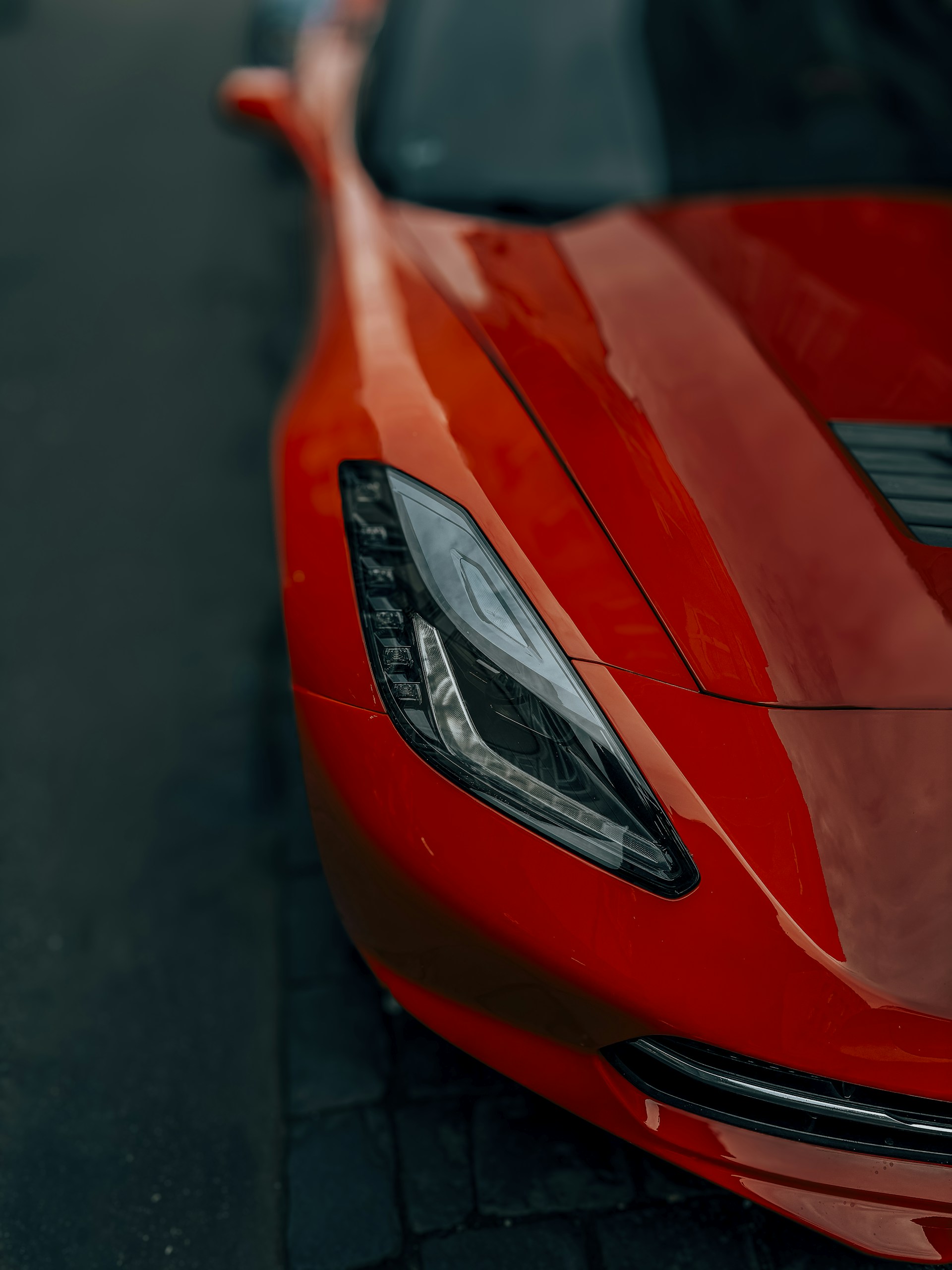 a close up of a red sports car