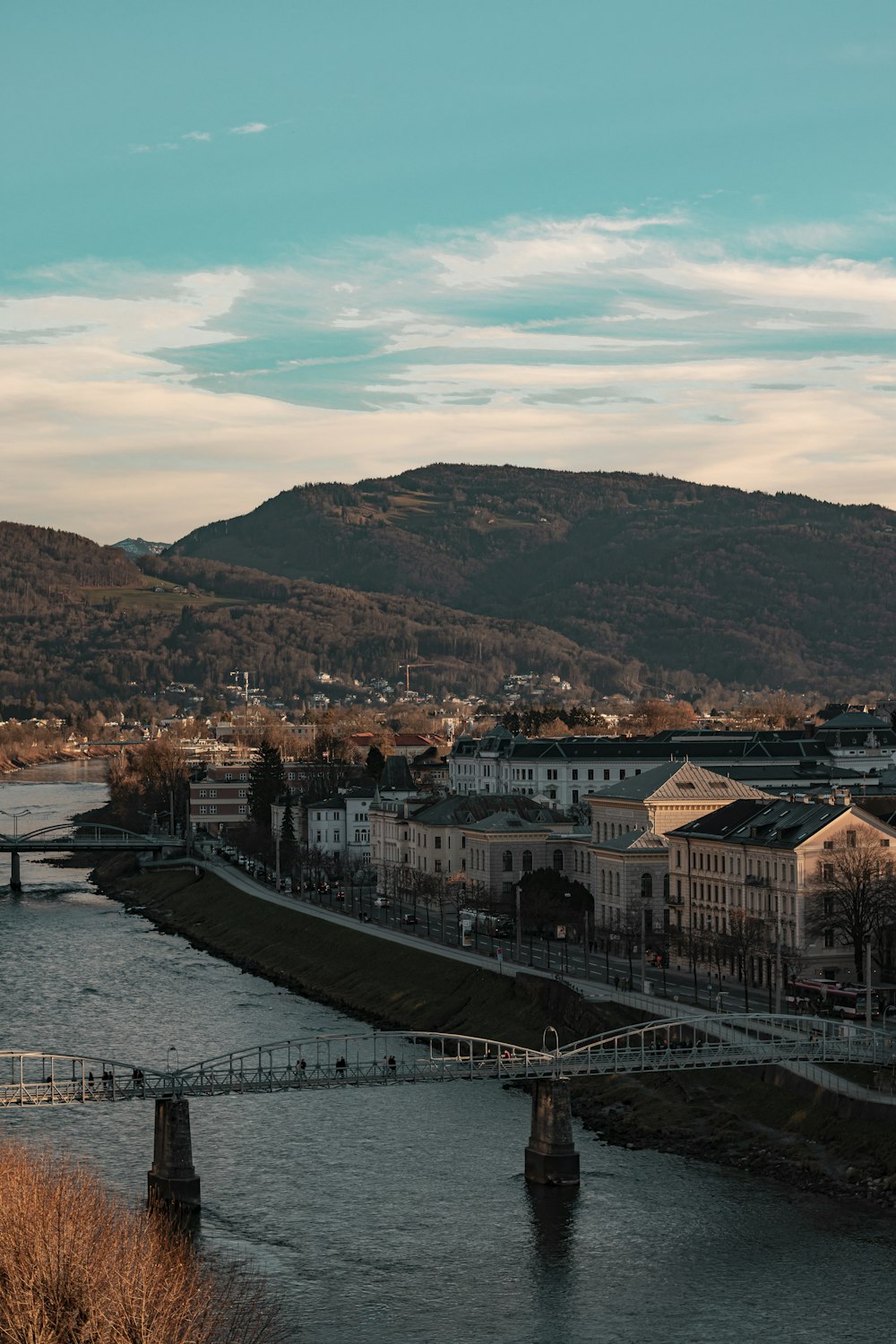 a river running through a city next to a bridge