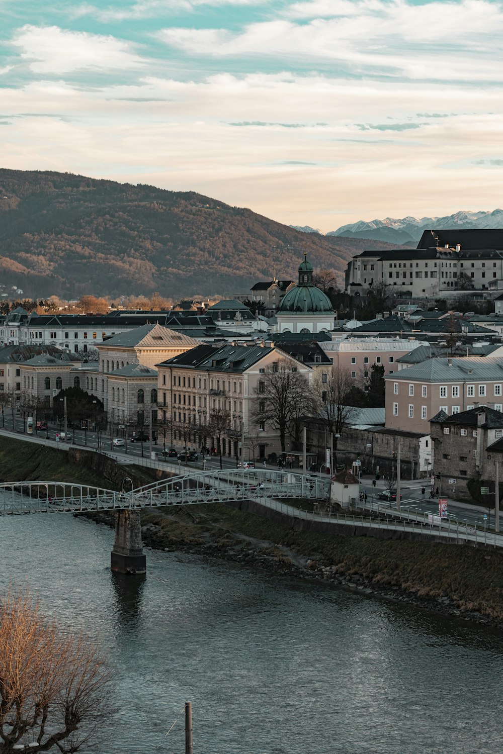 a river running through a city next to a bridge