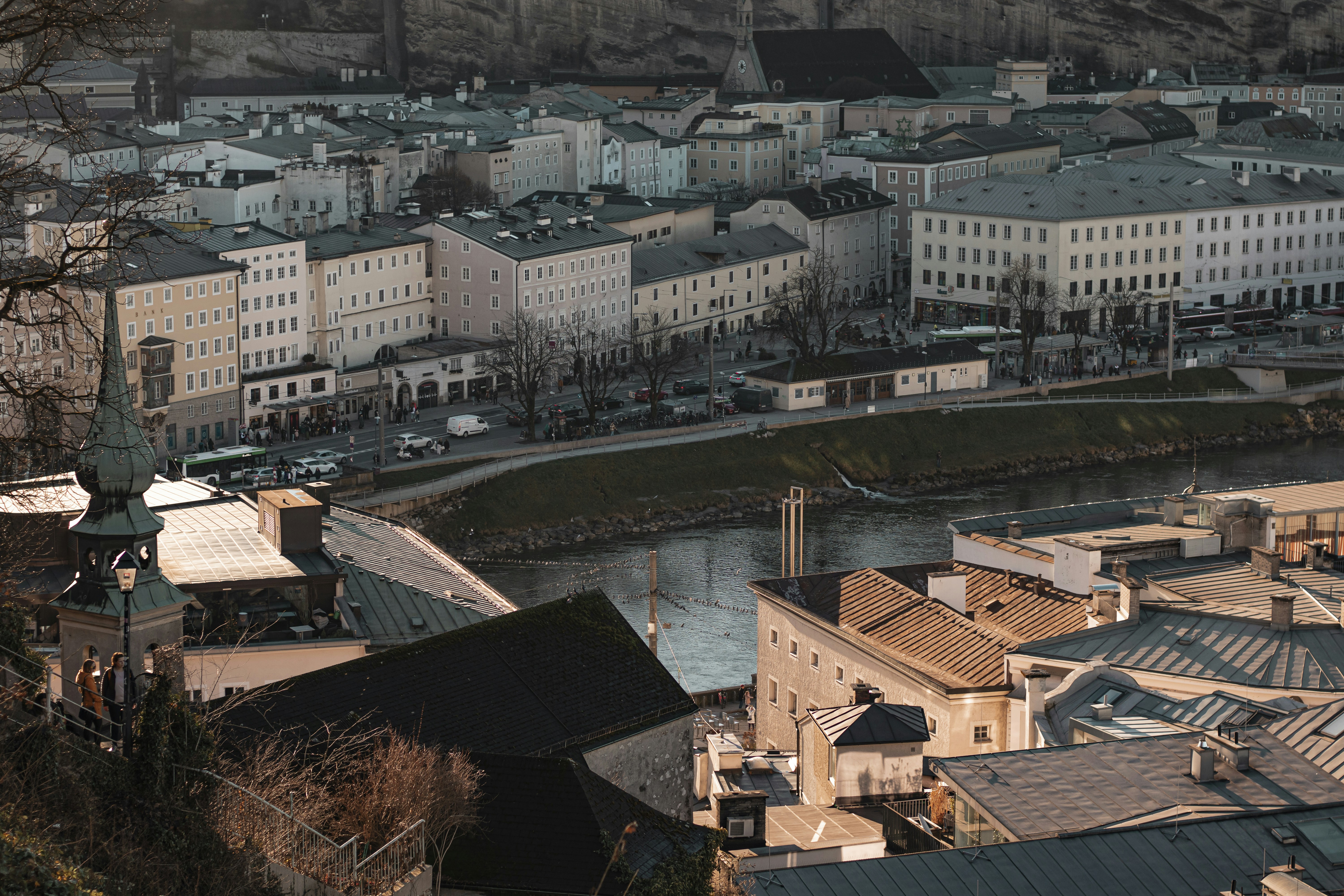 a view of a city with a river running through it, 