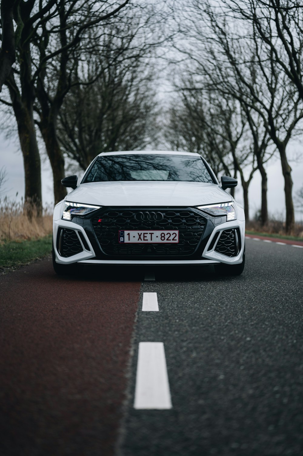 a white car parked on the side of the road