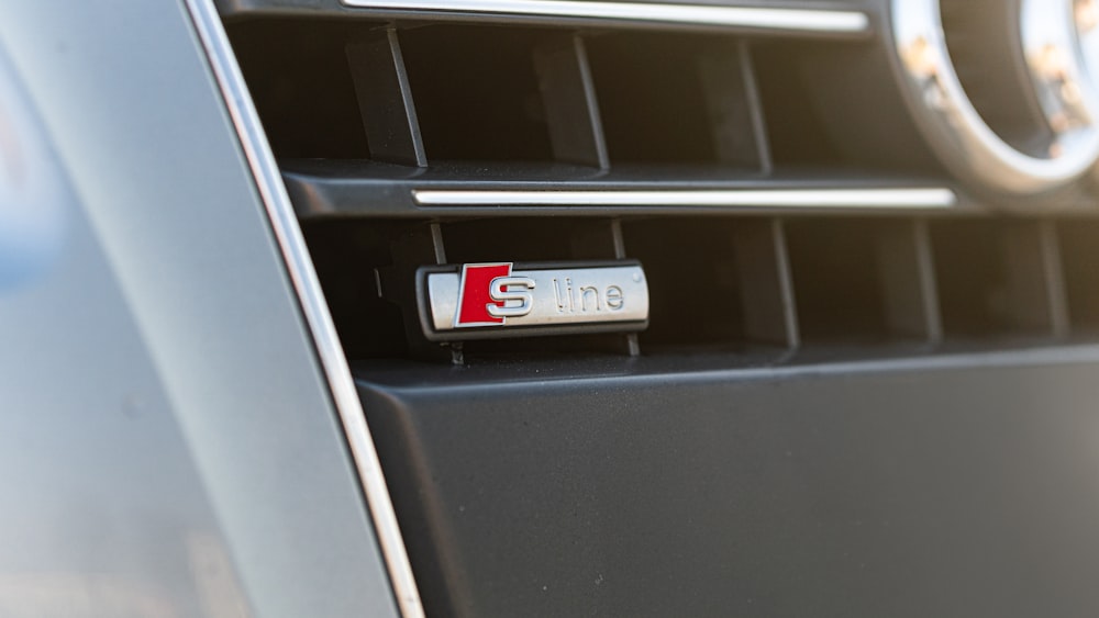 a close up of the front grille of a car