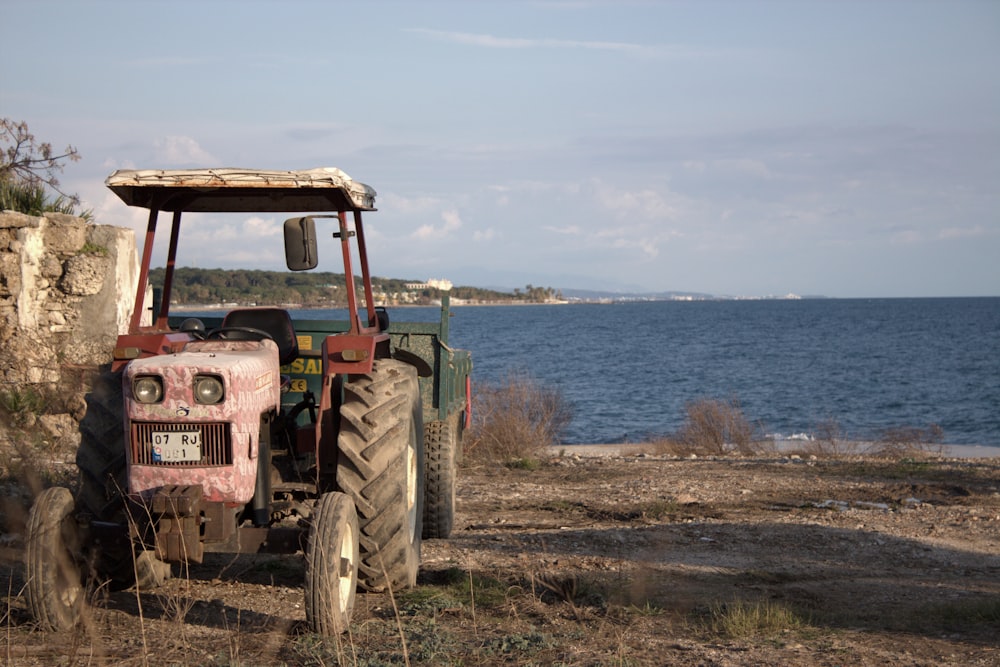 an old tractor parked on the side of the road