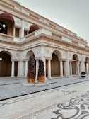 a large white building with columns and arches