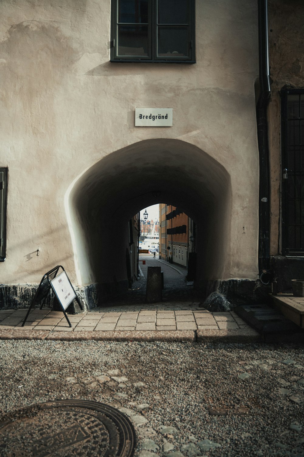 an entrance to a tunnel with a sign on it
