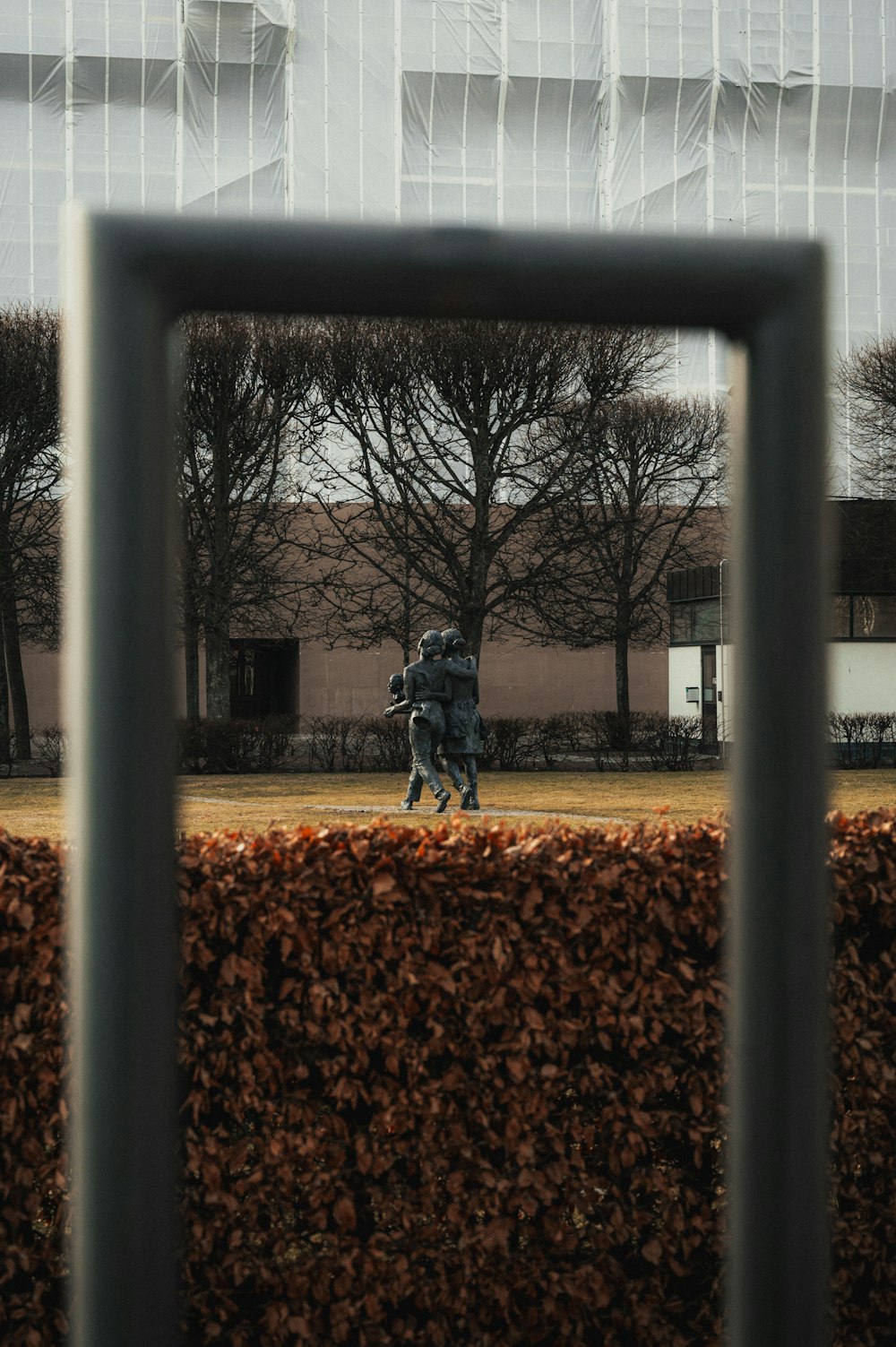 a couple of people that are standing in the grass