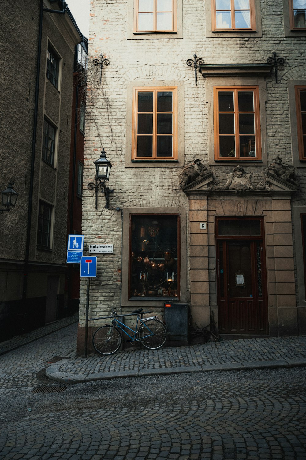 a bicycle is parked in front of a building