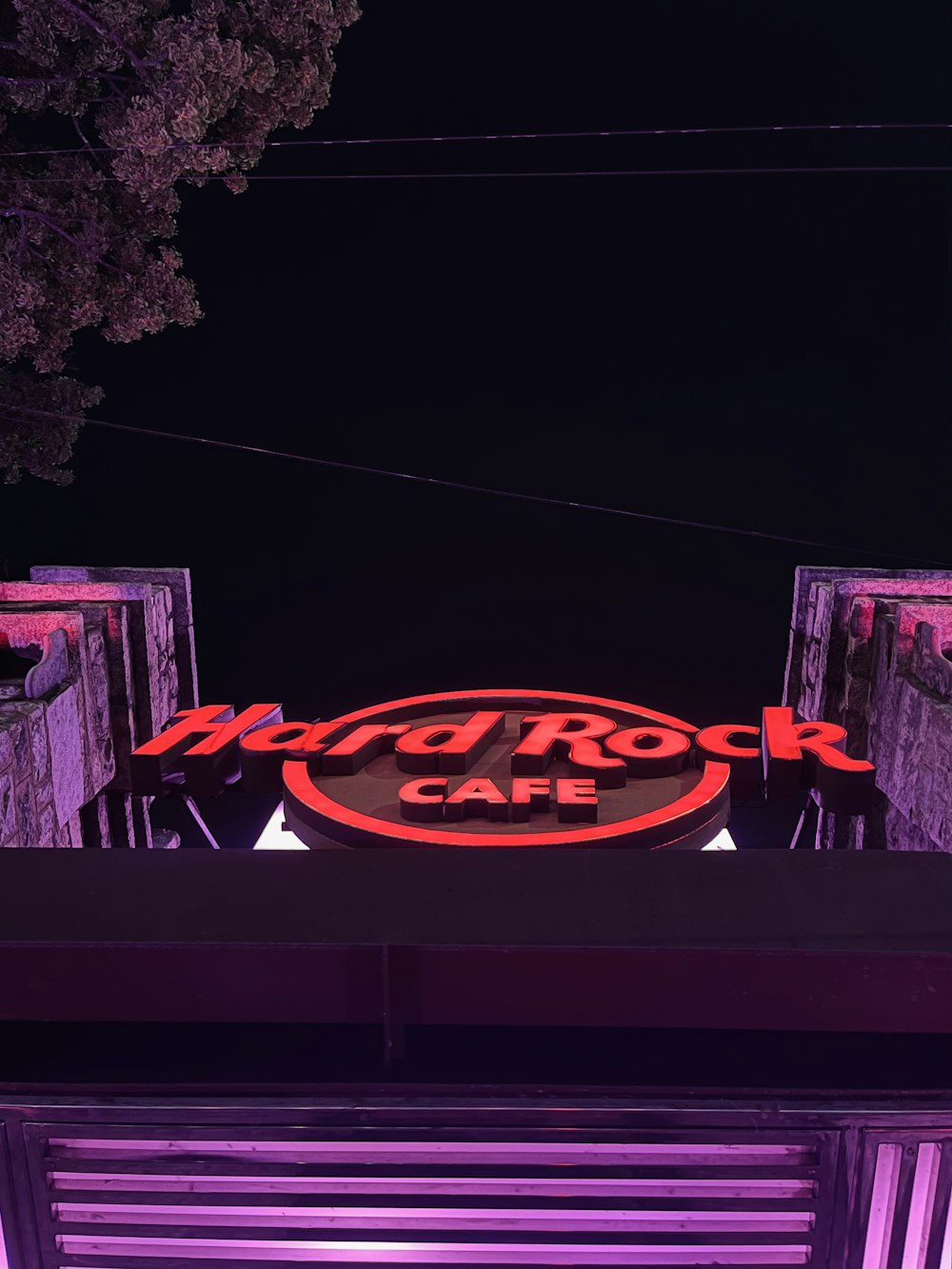 a neon sign on the side of a building