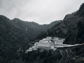 a large white building sitting on top of a mountain