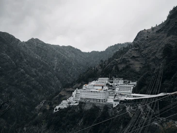 a large white building sitting on top of a mountain
