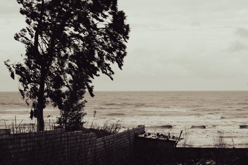 a boat is out on the water near a fence