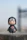 a small toy is sitting on a ledge