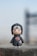 a small toy is sitting on a ledge