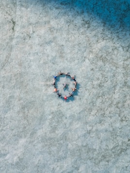 a group of people standing in the middle of a circle