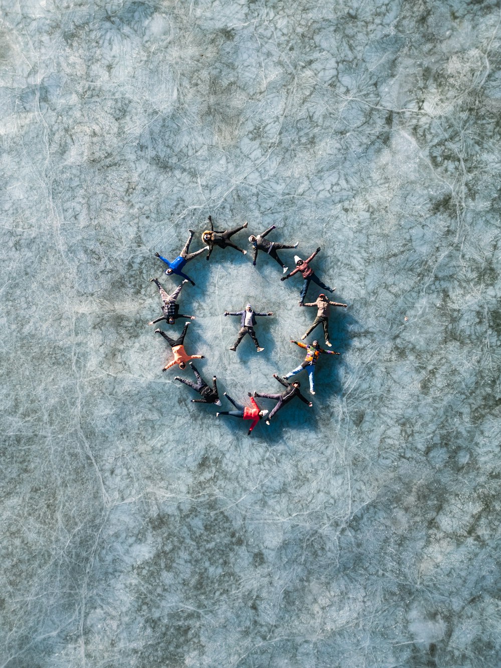 a group of people standing in the shape of a circle