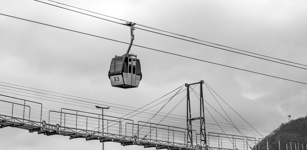 a black and white photo of a cable car