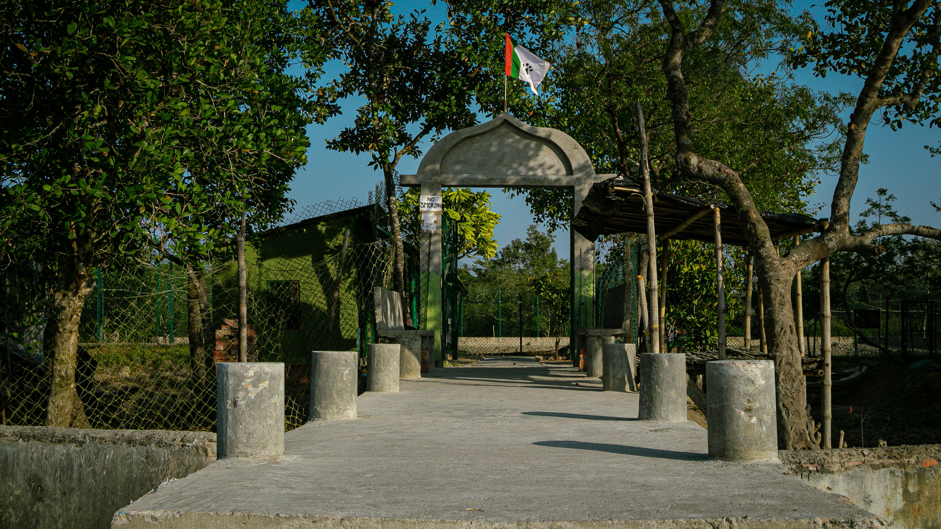 a gate with a flag on top of it