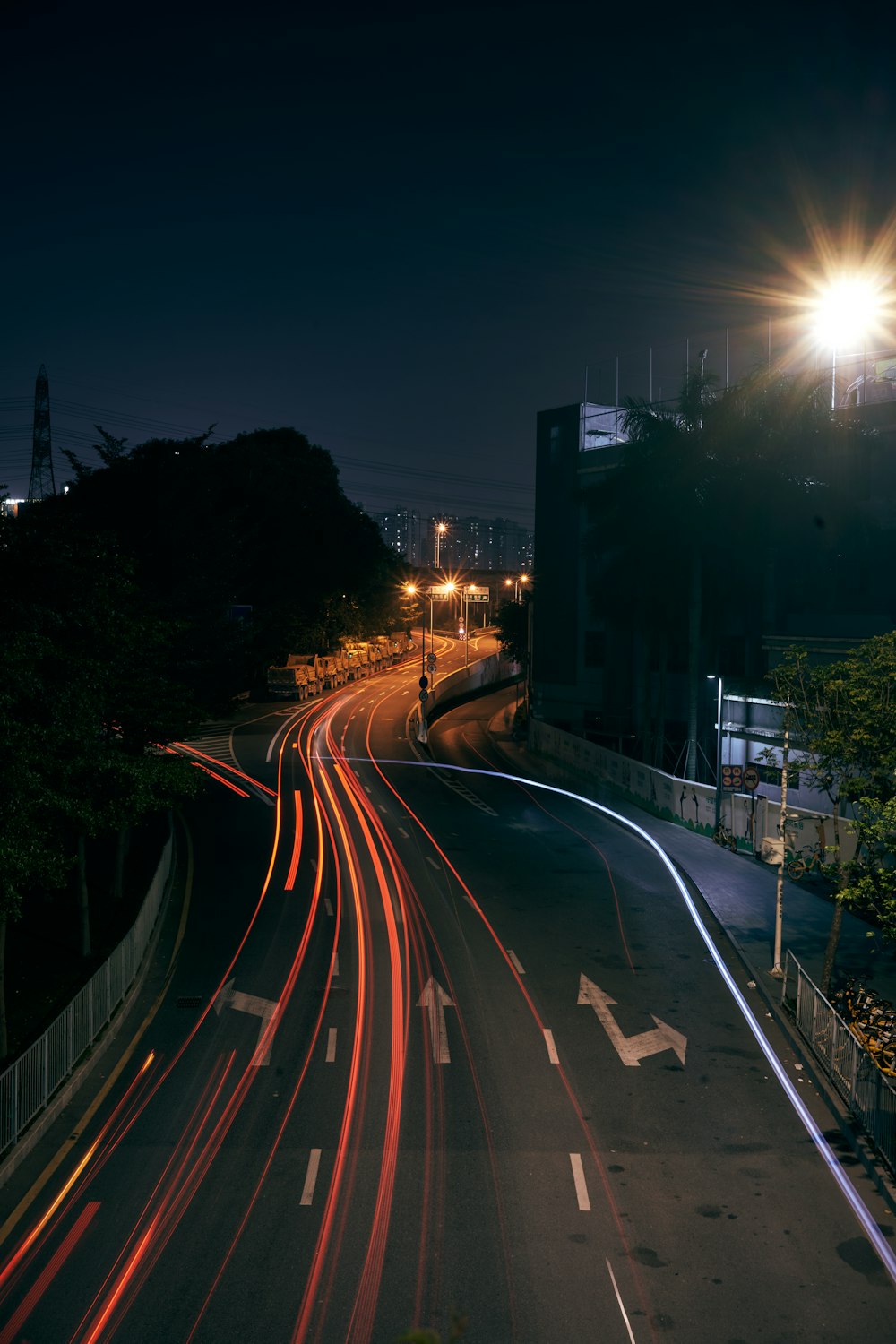 a city street at night with light streaks