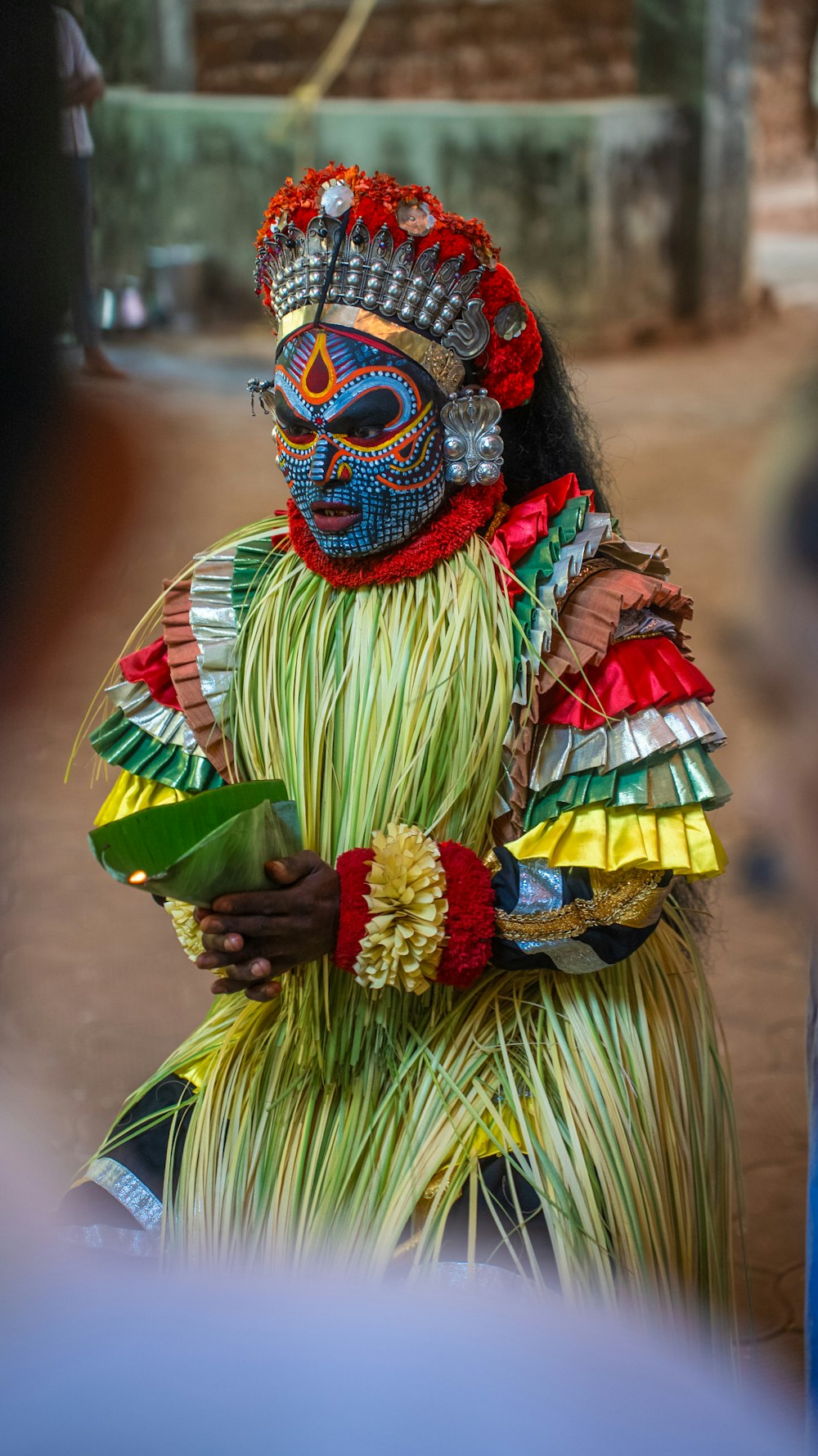 a woman dressed in a colorful costume and headdress