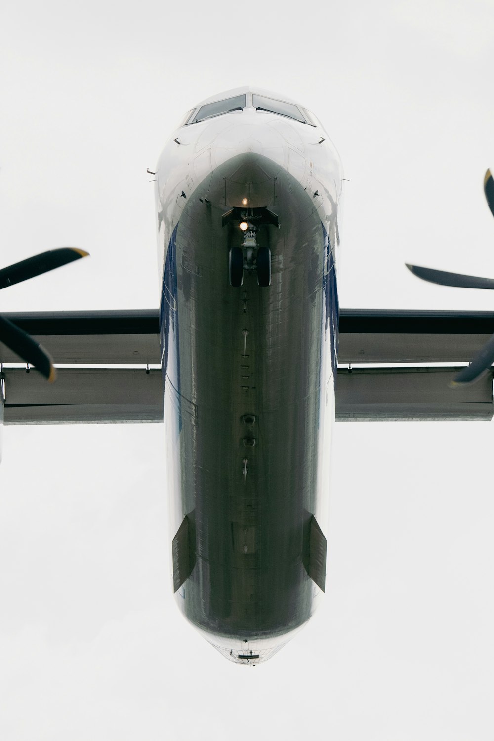 a large jetliner flying through a cloudy sky