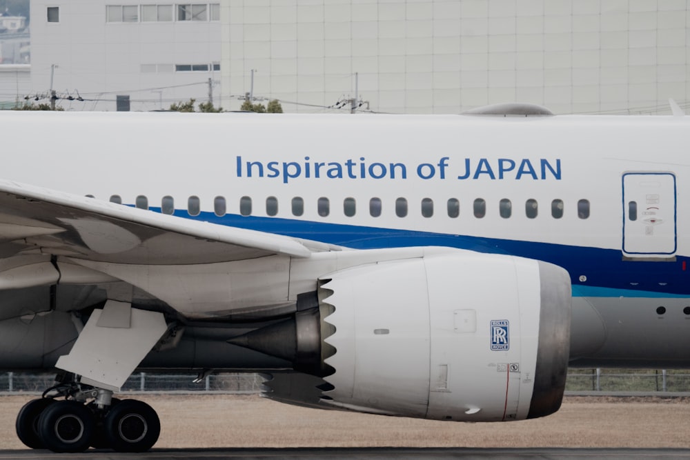 a large jetliner sitting on top of an airport tarmac