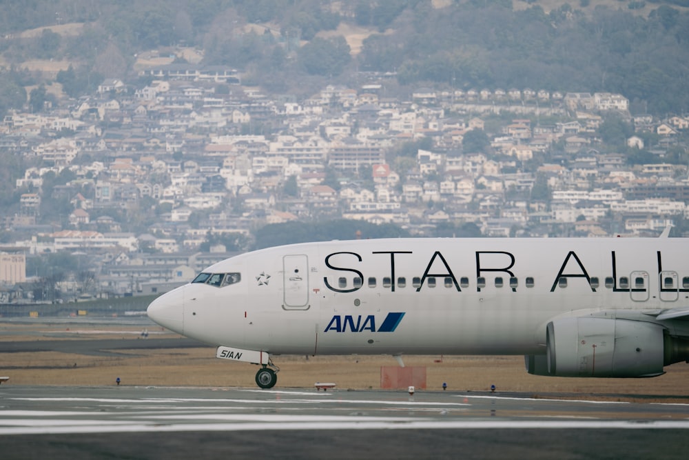 a large white airplane on a run way