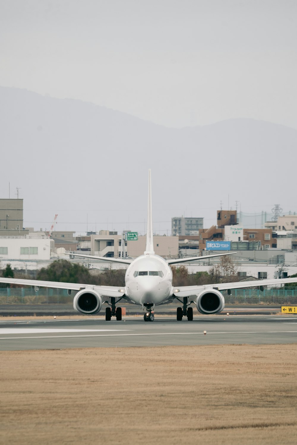 a large jetliner sitting on top of an airport runway