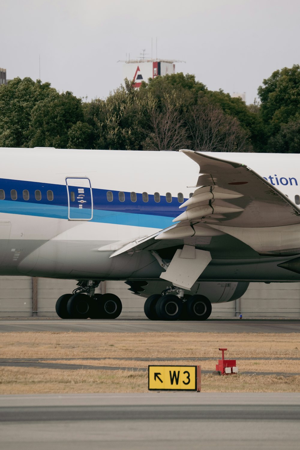 a large jetliner sitting on top of an airport runway