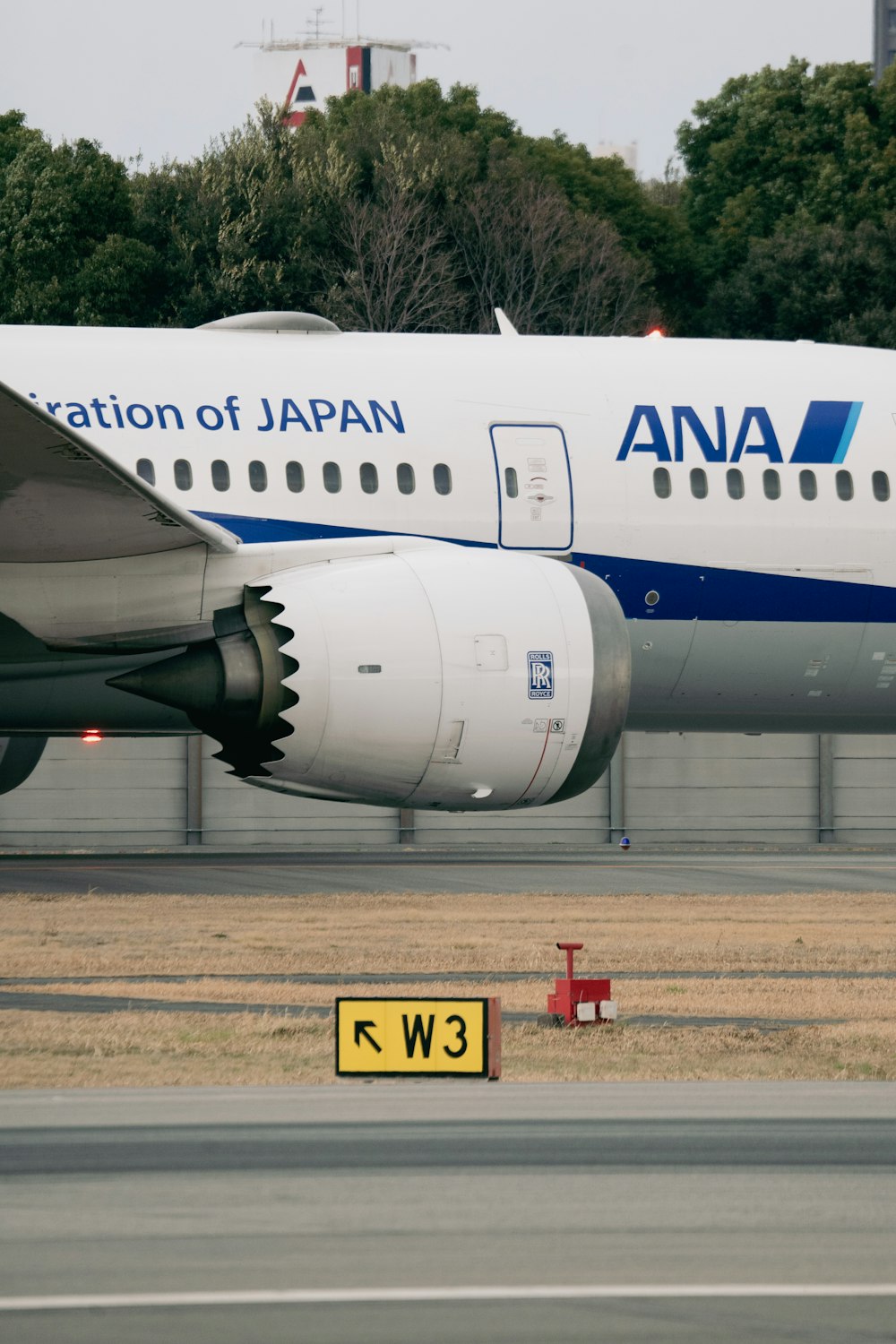 a large jetliner sitting on top of an airport runway