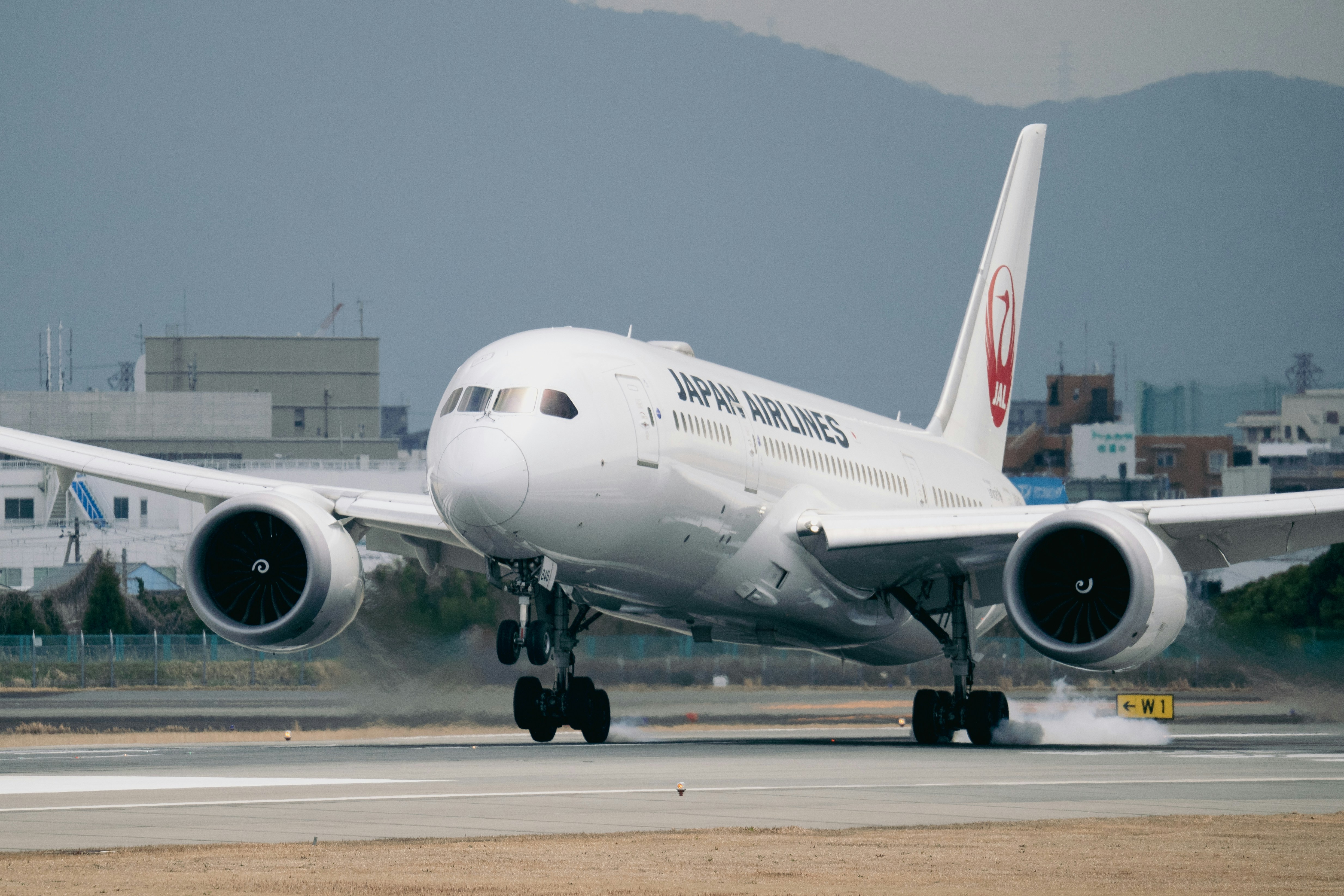 a large jetliner taking off from an airport runway