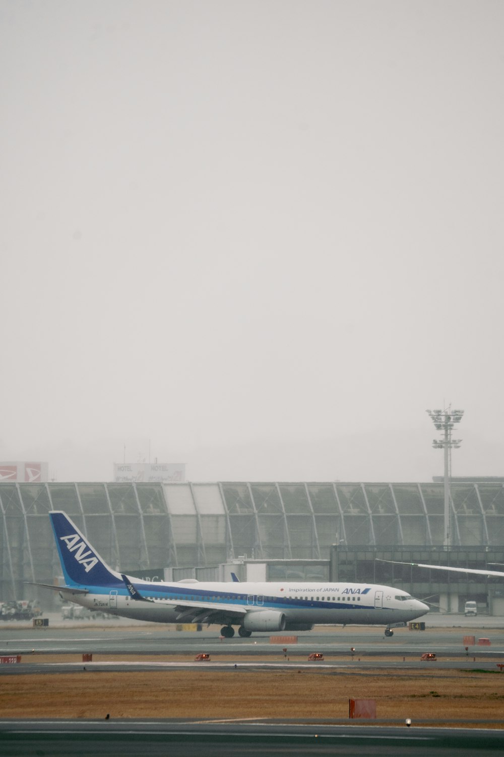 a large jetliner sitting on top of an airport runway