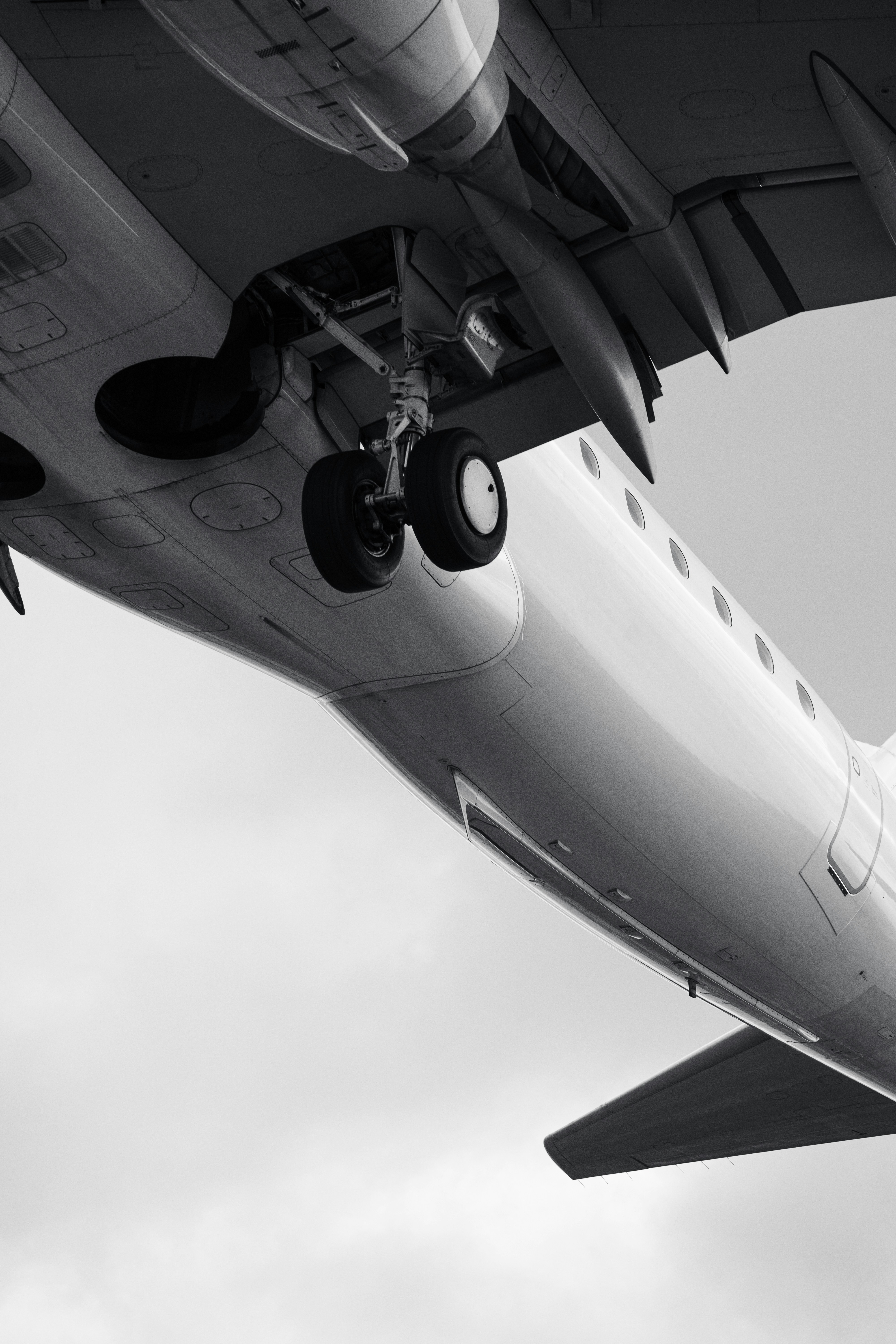 a large jetliner flying through a cloudy sky