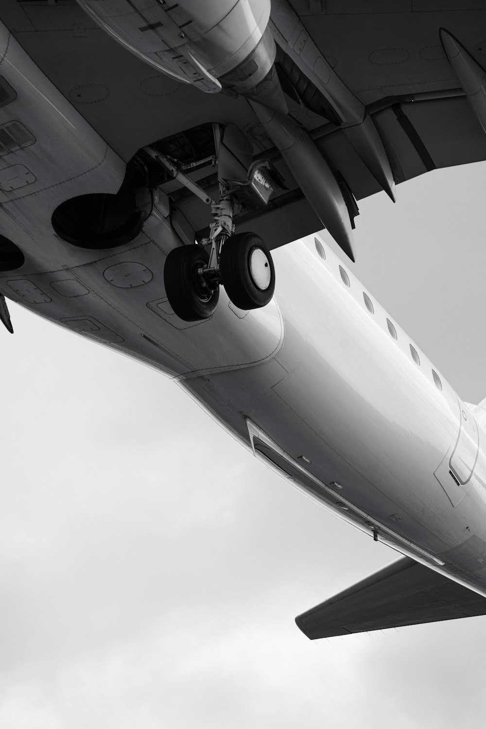 a large jetliner flying through a cloudy sky