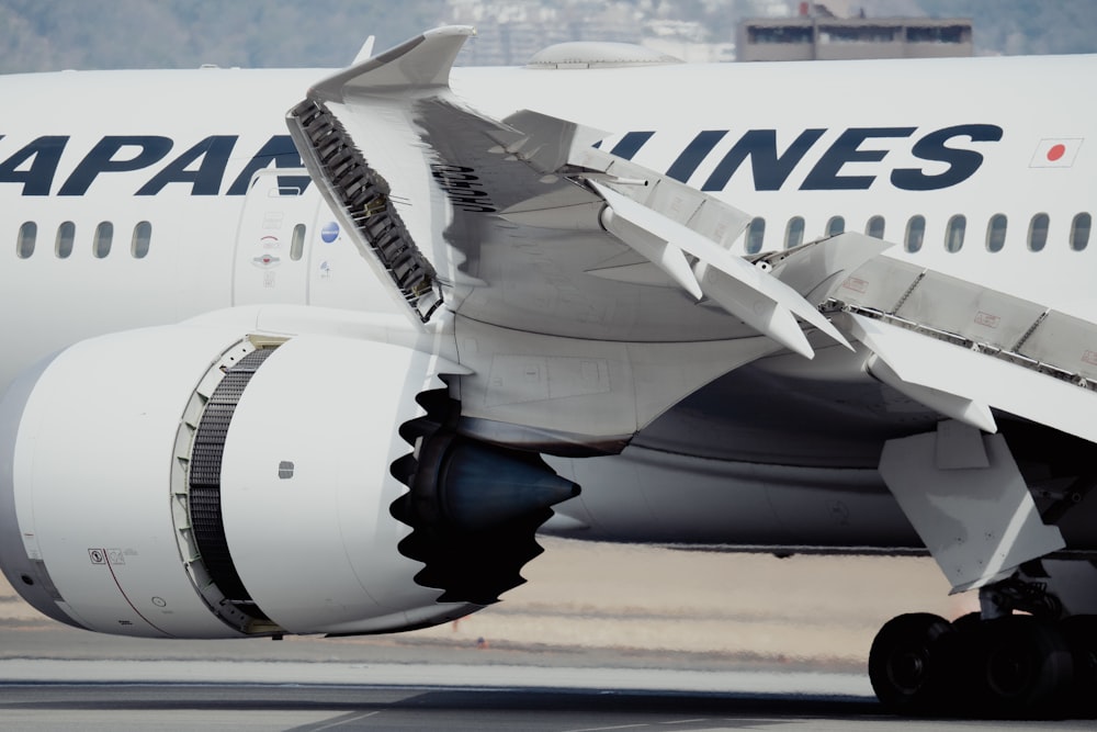 a large jetliner sitting on top of an airport tarmac