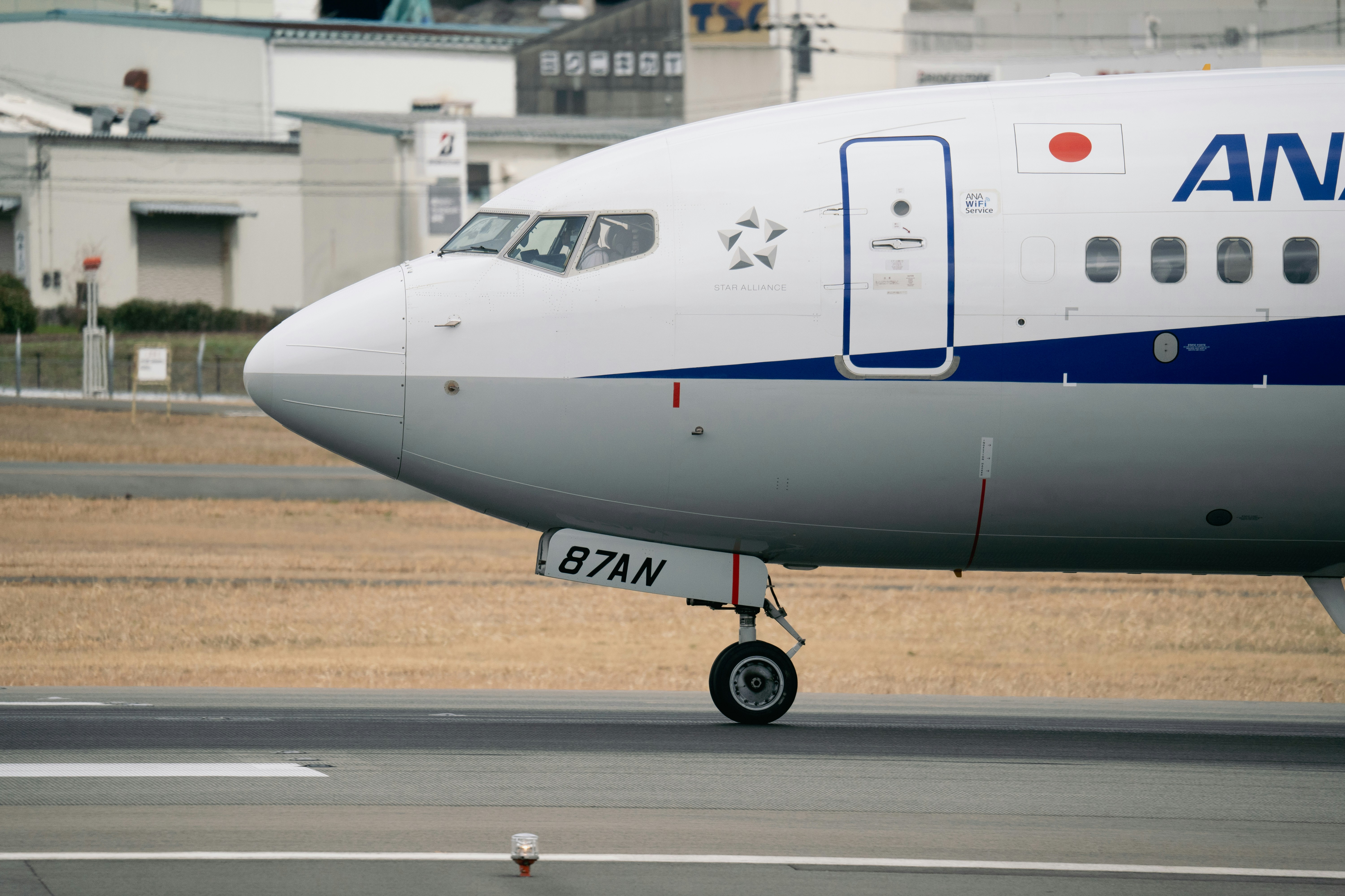 a large commercial airplane on a run way, 