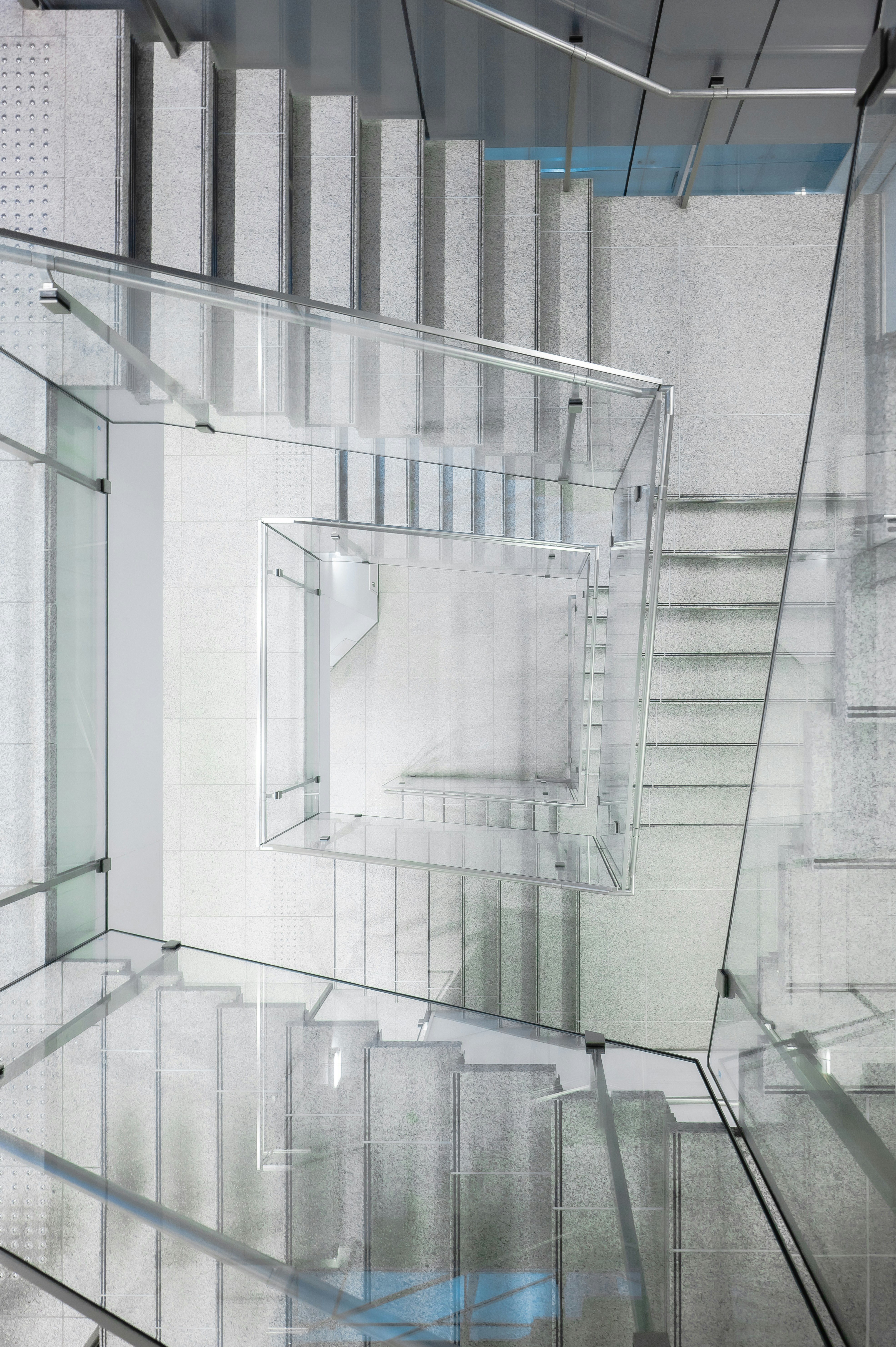 a staircase with glass railings leading up to it