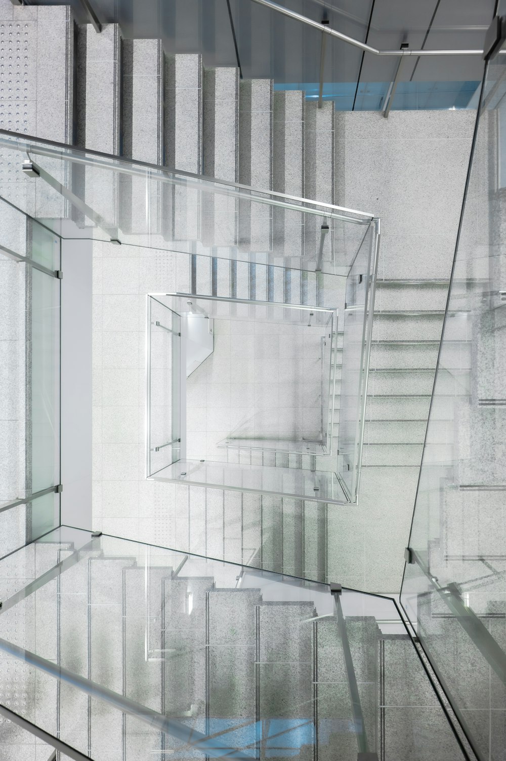 a staircase with glass railings leading up to it