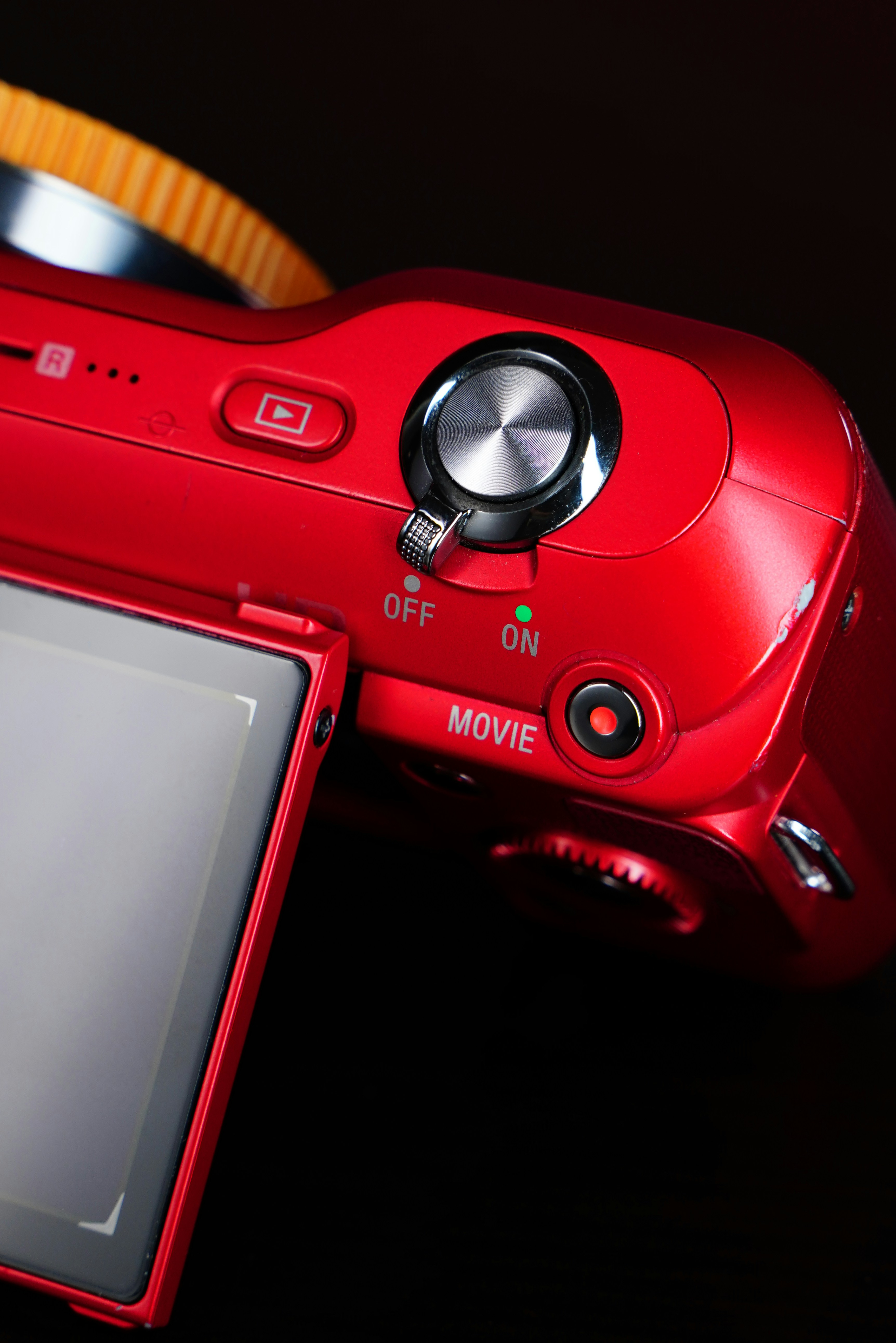 a red camera sitting on top of a table