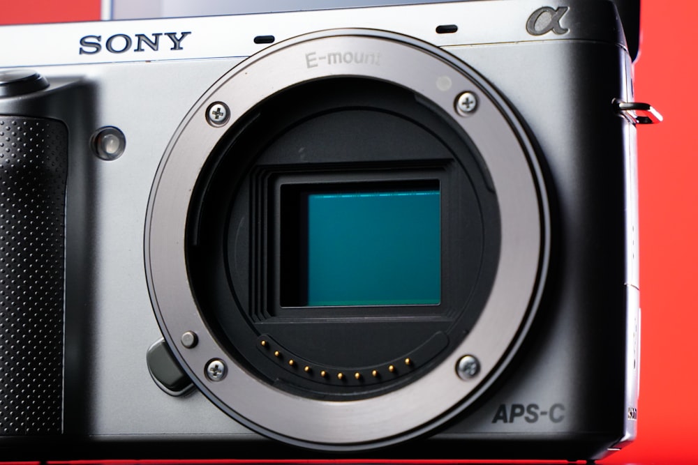 a sony camera with a red background
