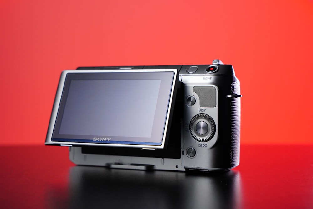 a digital camera sitting on top of a table